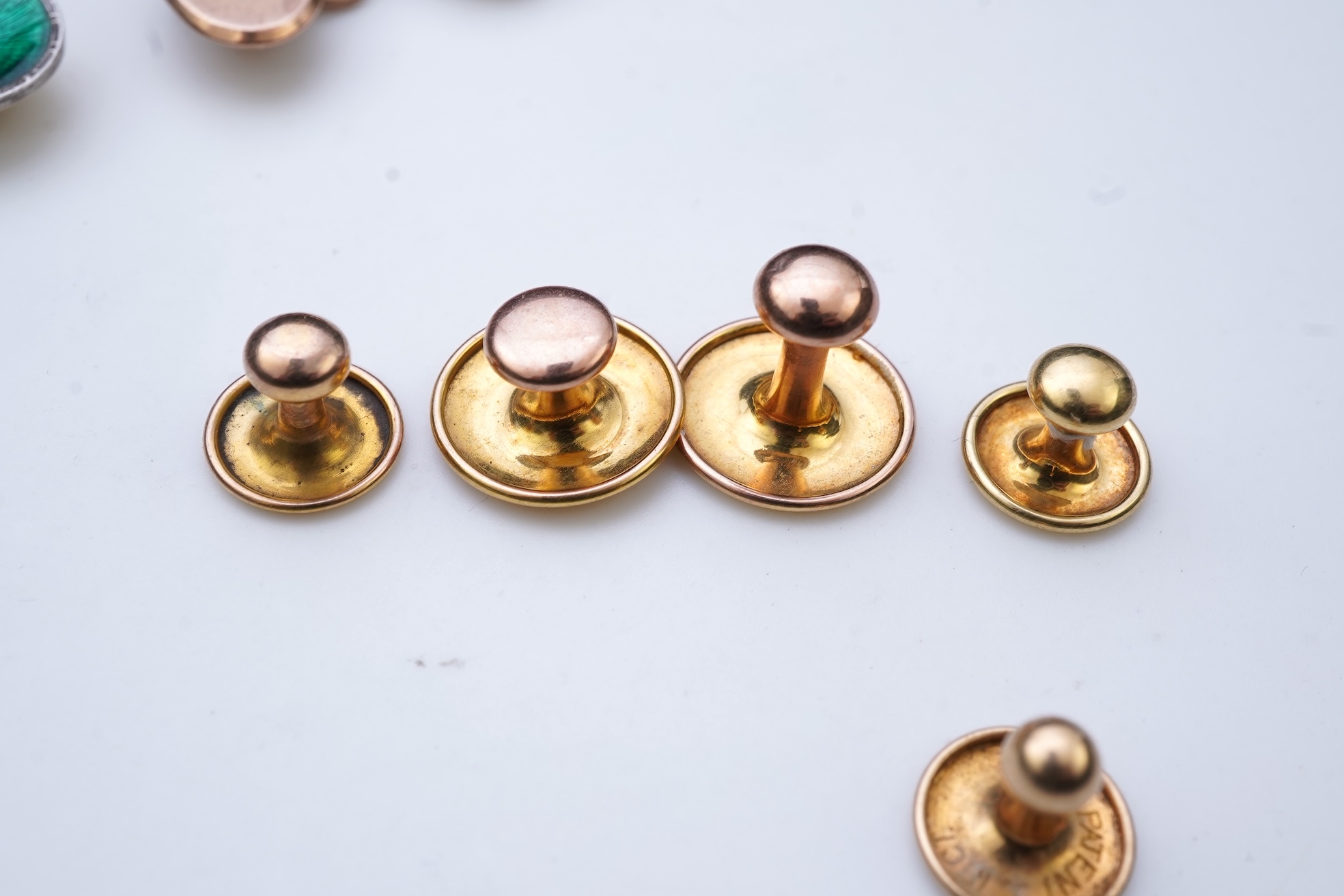 A collection of cufflinks and dress studs